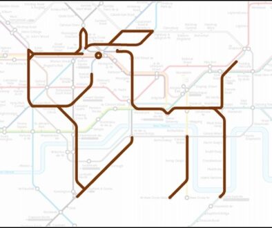Map design forming the outline of a dog with a collar and tag, using brown lines on a background of a faded subway map featuring multicolored intersecting routes and station names in light gray.
